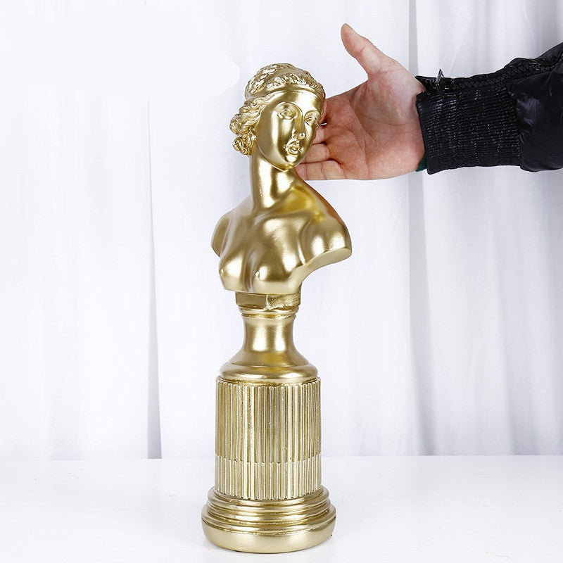 Decorazione artigianale in resina dorata