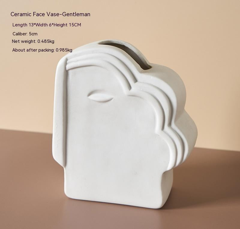 Vase en céramique avec visage abstrait